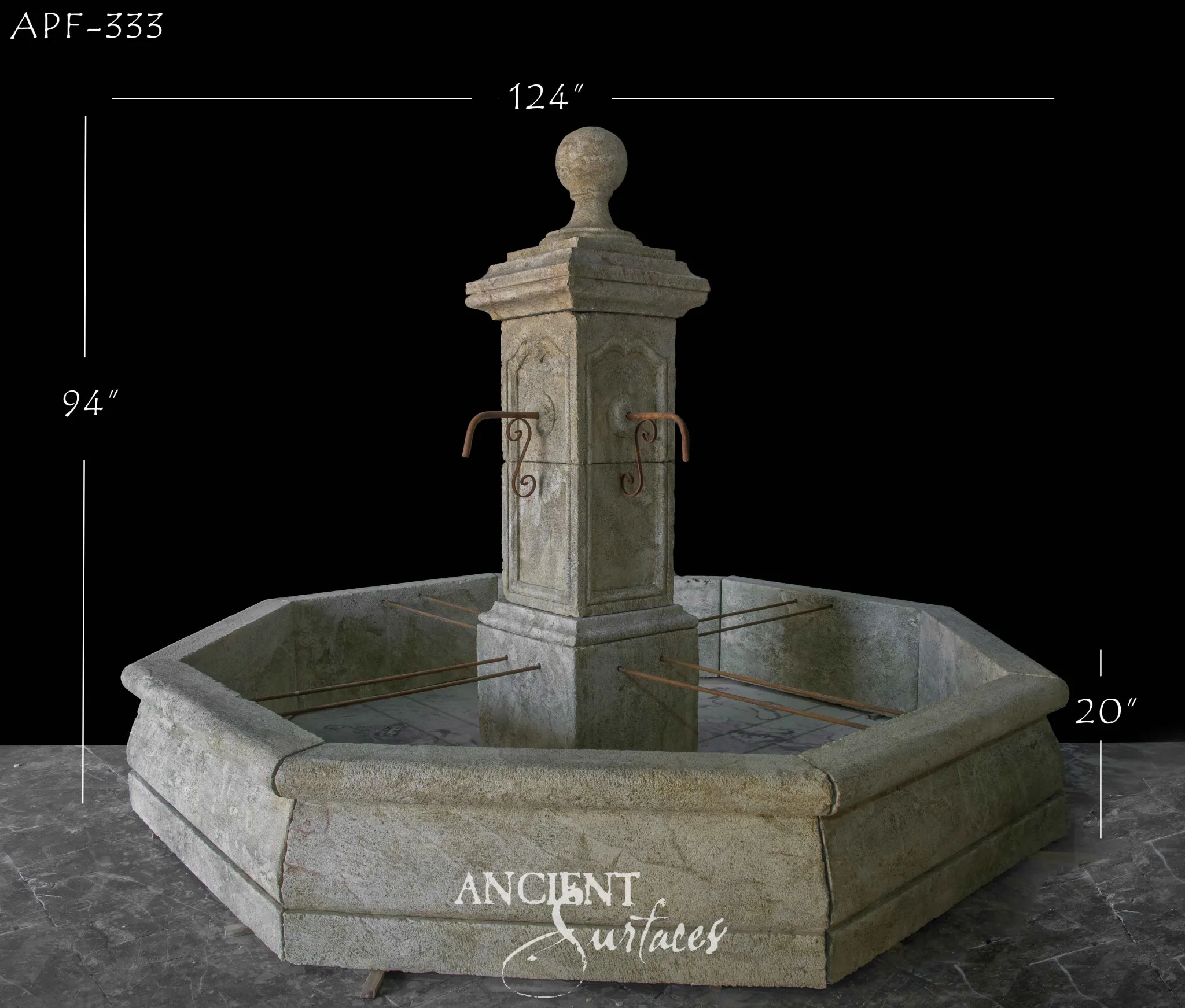 Weathered octagonal reclaimed limestone pool fountain with a tall central pillar and iron spouts